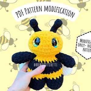 May include: Crochet pattern modification for a bee amigurumi toy. The pattern is for a yellow and black bee with large, sparkly eyes. The text "PDF PATTERN MODIFICATION" and "MODIFICATION ONLY - NOT FULL PATTERN" is visible in the image.