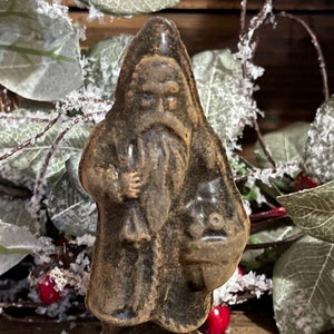 Small Blackened Beeswax Santa with Satchel of Fruit