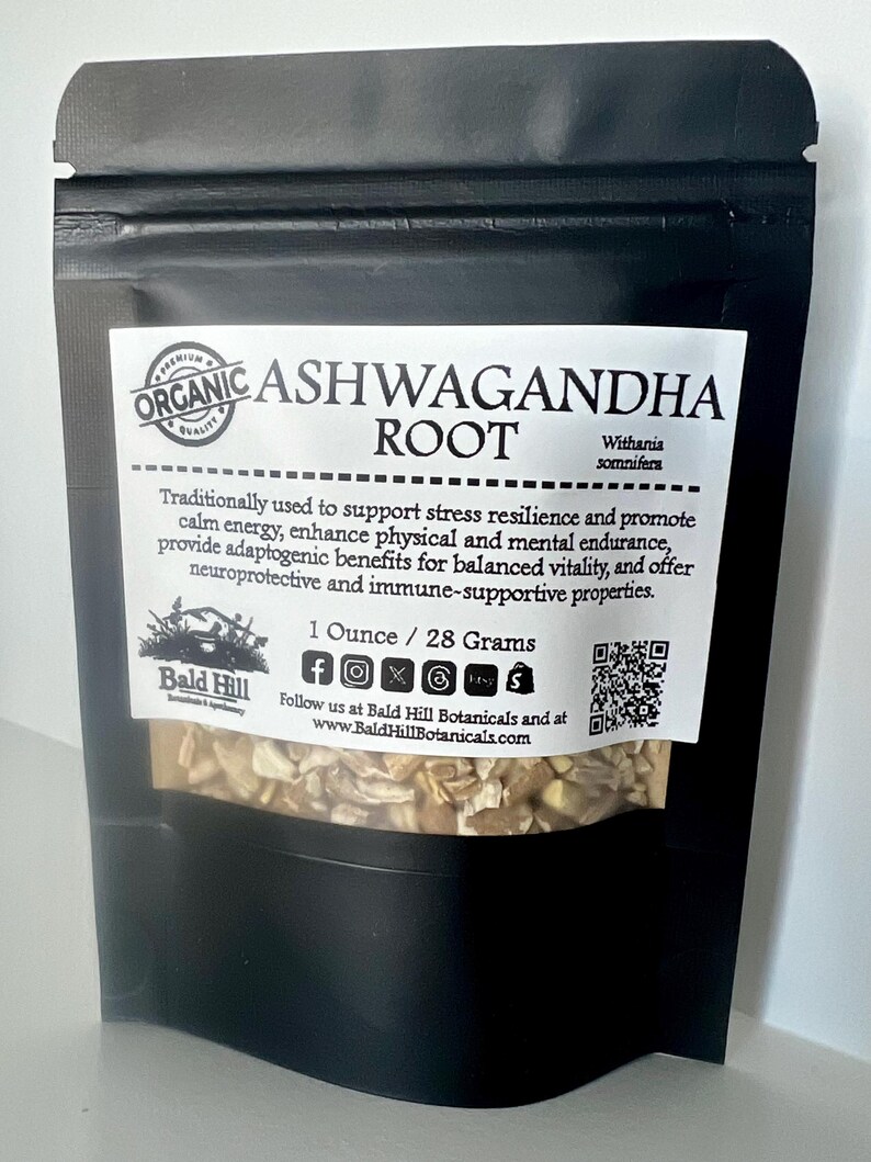 May include: A black pouch of organic Ashwagandha root. The label reads "Organic Ashwagandha Root" and lists the benefits. The pouch contains 28 grams of the product. The brand name is Bald Hill Botanicals.