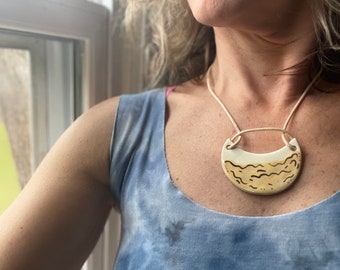 Statement pale yellow ripple ceramic necklace with gold accents