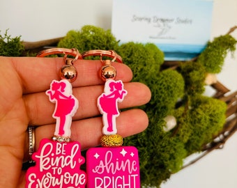 Shine bright and be kind to everyone! Positive message keychains in hot pink with rose gold metal. Sparkle and shine!