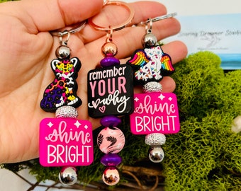 Colorful rainbow keychains with positive messages! Remember your why and shine bright! Leopards and florals, gifts with purpose!
