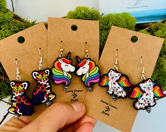 Rainbow,unicorn,angel cat, leopard, silicone beaded earrings. Vibrant, colorful and so much fun!These unique earrings make the perfect gift!