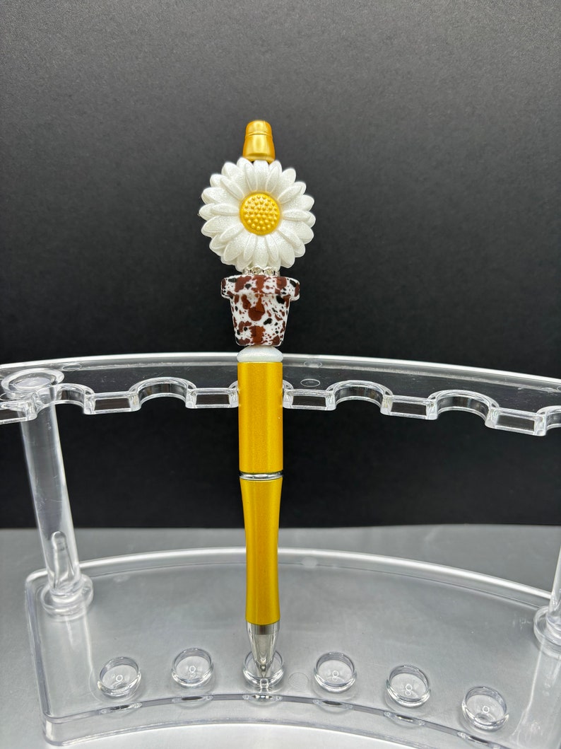 Springtime floral gifts. These bright and colorful marbled pens are reusable and refillable. Opal Potted flowers, beaded pen. Yellow pen base