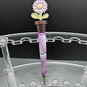 Springtime floral gifts. These bright and colorful marbled pens are reusable and refillable. Opal Potted flowers, beaded pen. Purple pen base