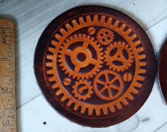 brown  leather coaster with steampunk cogs and wheels  design handmade in uk 4 inch