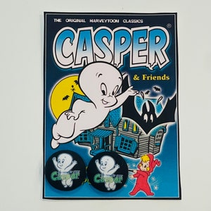 May include: A vintage Casper the Friendly Ghost cartoon character sticker sheet with two round stickers featuring Casper in a black circle with the text "The Friendly Ghost Casper". The sheet also features a cartoon image of Casper flying with a house and bats in the background. The text "The Original Harveytoon Classics Casper & Friends" is at the top of the sheet.