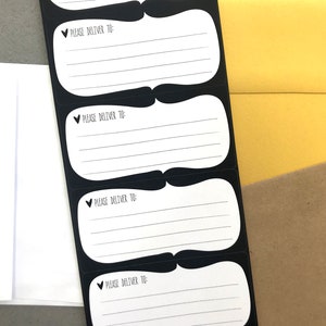 May include: Four black and white delivery address labels with the text "Please Deliver To:" printed on each label.