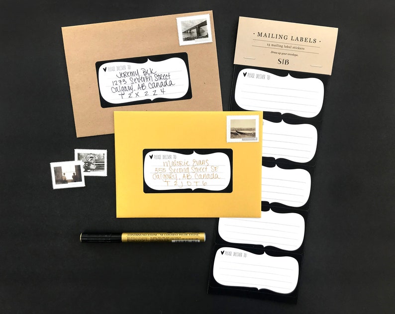 May include: A pack of 15 blank mailing labels with a black border and a heart design. The labels are on a white background and are packaged in a clear plastic sleeve. The text "MAILING LABELS" and "SIB" are printed on the packaging.