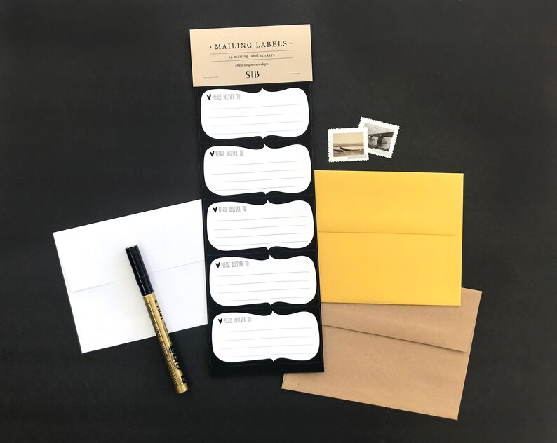 May include: A set of five white mailing labels with black borders and the text "Please deliver to" on each label. The labels are attached to a black card with the text "Mailing Labels" and "&pound;1B".