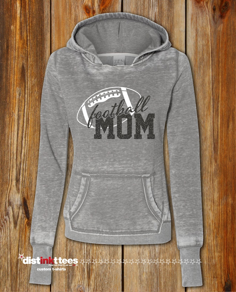 May include: Gray hooded sweatshirt with a white football graphic and the text "football MOM" in black glitter.