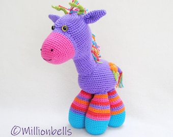 May include: A purple crocheted giraffe toy with pink ears, green and yellow yarn mane, and colorful striped legs.