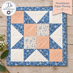 May include: A square quilt block featuring a geometric star pattern constructed from fabric squares and triangles. The design incorporates a blue floral print, solid cream fabric, and a peach-colored floral print. Text reads TJs Quilt Patterns.