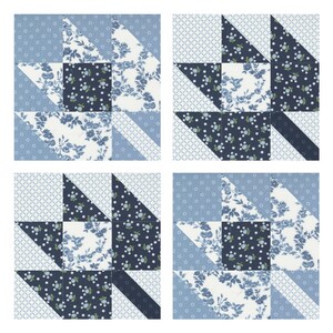 Puede incluir: Un bloque de colcha de retazos azul y blanco con un dise&ntilde;o de estrella. El bloque est&aacute; hecho de diferentes telas con patrones florales y dise&ntilde;os geom&eacute;tricos.