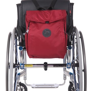 Wheelchair dark red backpack adapted safe bag two-in-one disabled accessory easy access handicap easy mobility everyday travel