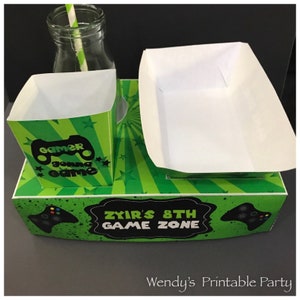 Gamer themed party lunch box with hotdog nacho tray and popcorn box with green background and controller images perfect for video game party or slumber party. Great snack box, concession food tray, PDF template. personalise with your birthday message