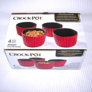 May include: A set of four red and black stoneware ramekins in a box. The ramekins are 4 inches (10.16 cm) in diameter and have a ribbed design. The box is labeled "Crock-Pot" and "Non-Electric Cookware".