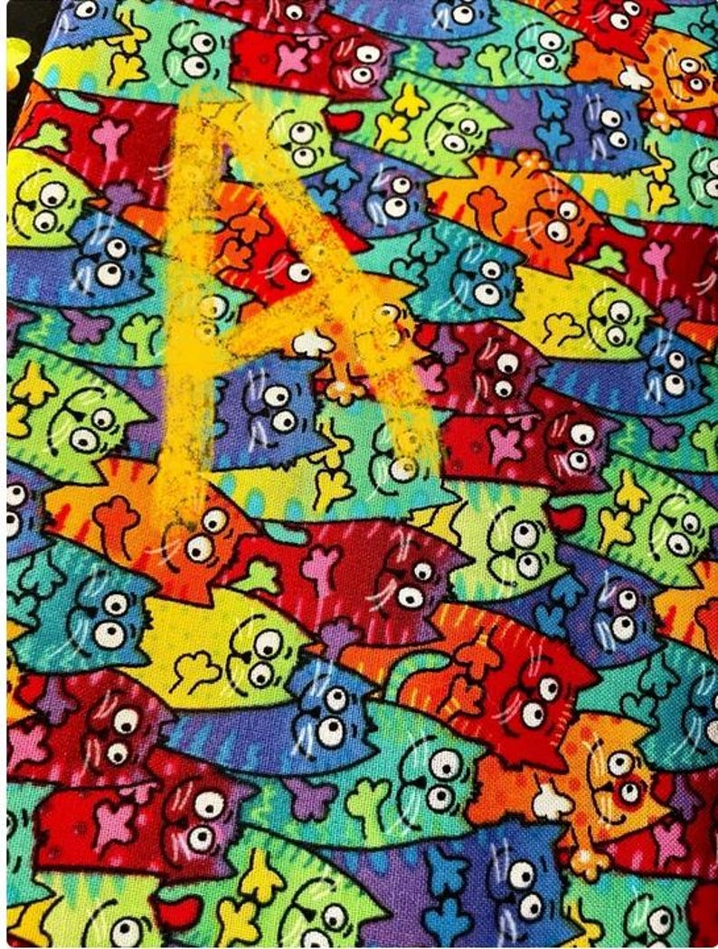 May include: A colorful fabric with a repeating pattern of cartoon cats. The cats are all different colors and have different expressions. The fabric is a great choice for a variety of projects, such as quilting, sewing, and crafts.