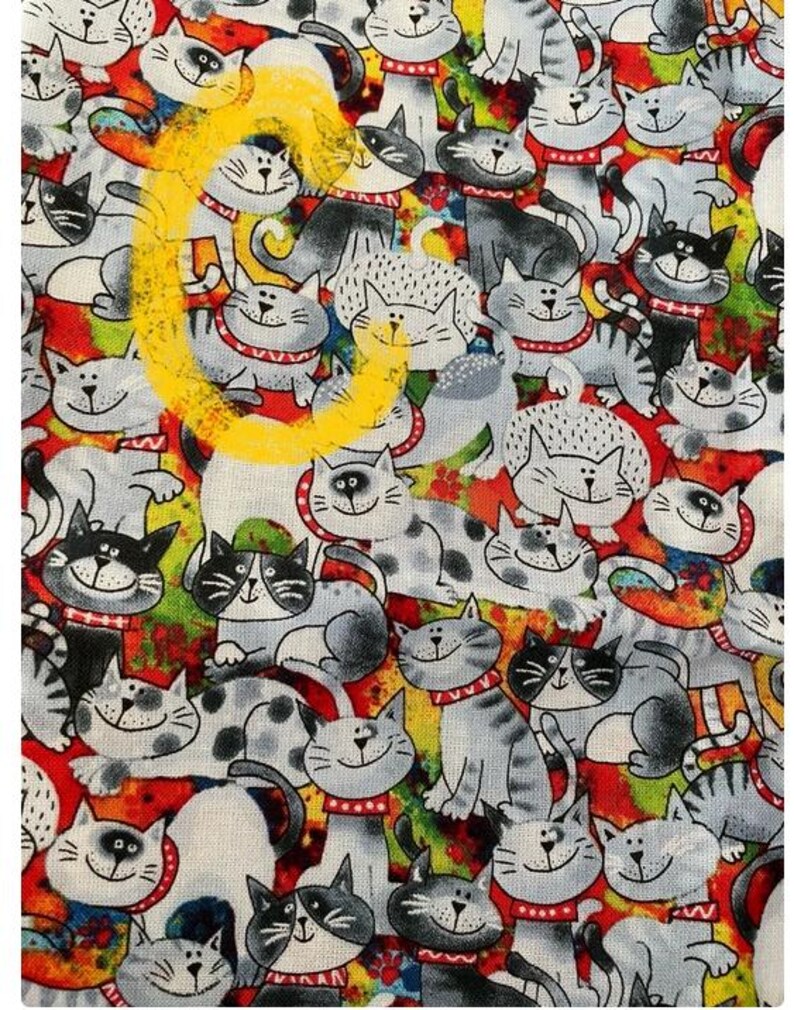 May include: A colorful fabric with a repeating pattern of cartoon cats. The cats are drawn in black and white with red collars and are set against a background of red, yellow, green, and blue.