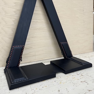 Padded footrest platform for St. Andrew’s Cross
