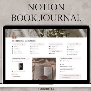 May include: A laptop screen displaying a Notion book journal dashboard. The screen shows sections for a library, favorites, reading overview, and quick add. The text "NOTION BOOK JOURNAL" is at the top. The bottom right corner has the text "AMOORELLA".