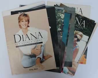 May include: A collection of magazines featuring images of Diana, Princess of Wales. The cover of the primary magazine shows Diana in a white shirt and jeans, with the title "DIANA THE UNTOLD STORY". Other magazines are visible, with various images of Diana.