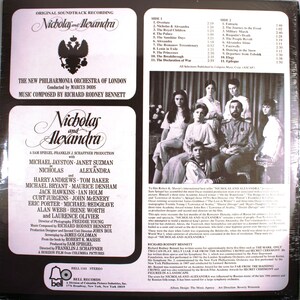 May include: A vintage vinyl record cover for the film "Nicholas and Alexandra" featuring a black and white photo of the cast. The cover includes the film's title, the names of the actors, and the film's production company.