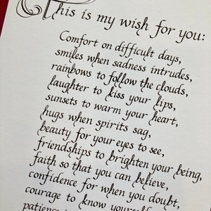 May include: Black ink calligraphy on white paper with the text "This is my wish for you:" followed by a list of wishes for comfort, smiles, rainbows, laughter, sunsets, hugs, beauty, friendships, faith, confidence, courage, patience, and love.