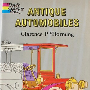 May include: A Dover Coloring Book titled "Antique Automobiles" by Clarence P. Hornung. The cover features a colorful illustration of a vintage car in red, pink, yellow, and white, set against a gray background.