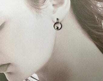 Circle stud and dangling silver earrings