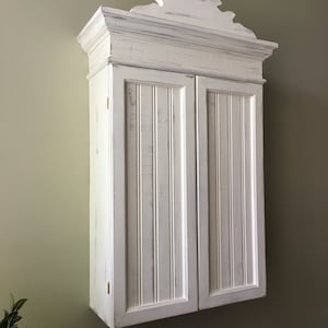 Distressed White Wall Cabinet: Cottage Style Beadboard Door
