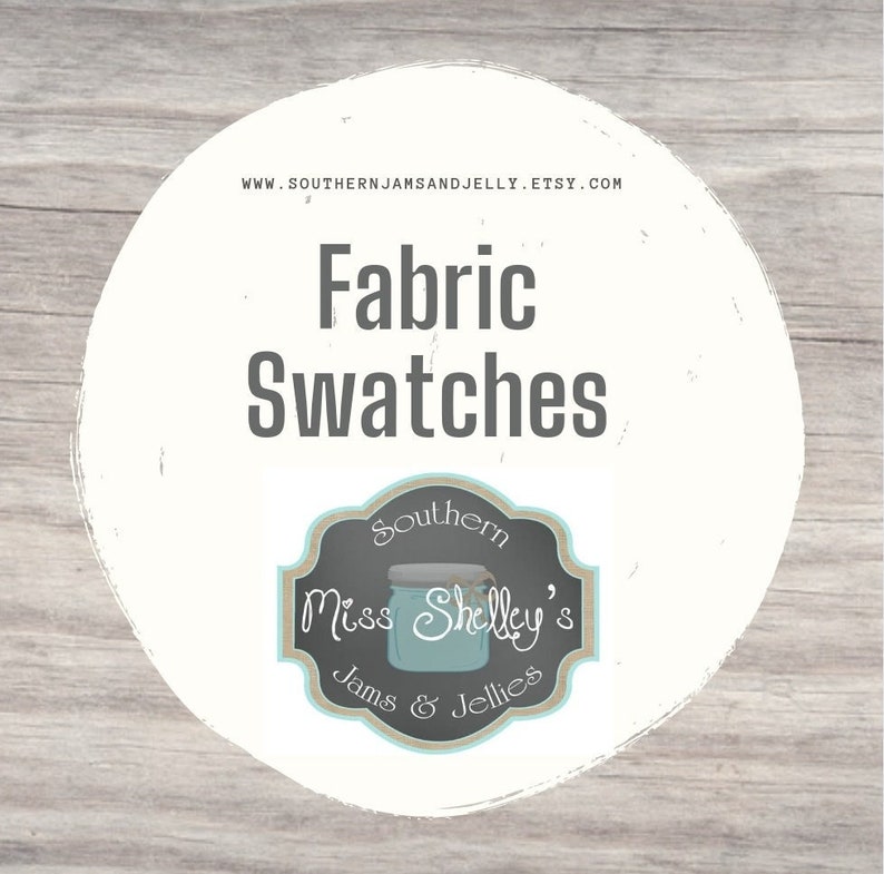 May include: A white circle with a black outline on a woodgrain background. The circle contains the text "Fabric Swatches" and a logo for "Miss Shelly's Jams & Jellies". The logo is a black and white illustration of a mason jar with the text "Southern" above it and "Jams & Jellies" below it.
