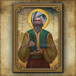 May include: A religious icon depicting Saint Ahmet, the Calligrapher. He is depicted with a green and brown robe, a white turban, and a beard. He is holding a cross in his right hand. The icon is framed in gold.