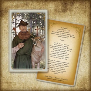 May include: A religious prayer card featuring a painting of Saint Hubert, a patron saint of hunters, holding a deer. The card includes a prayer to Saint Hubert and information about his life and feast day.