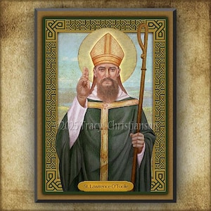 May include: A framed religious print featuring St. Lawrence O'Toole. The image depicts a man in green and white robes, holding a staff and raising his hand. The artwork has a gold halo and is surrounded by a green and gold Celtic knot border.