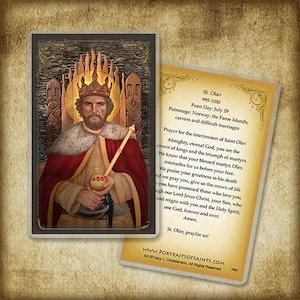 May include: A religious card featuring an illustration of St. Olav, a king with a crown and scepter. The card has a gold border and includes text about St. Olav's feast day, patronage, and a prayer. The background is a wood-carved design.