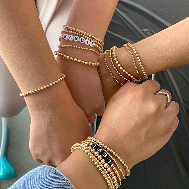 Gold beaded bracelet stack sale