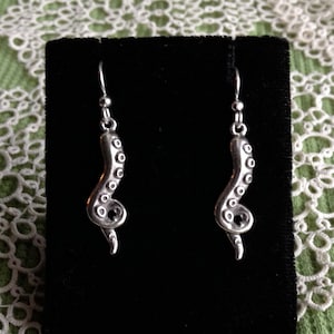 Alaskan Silver Octopus Tentacle Drop Earrings, cast in reclaimed silver, on silver ear wires