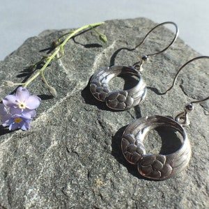 Silver Mobius Wings earrings, made in Alaska, cast in eco friendly reclaimed sterling silver, on sterling ear wires
