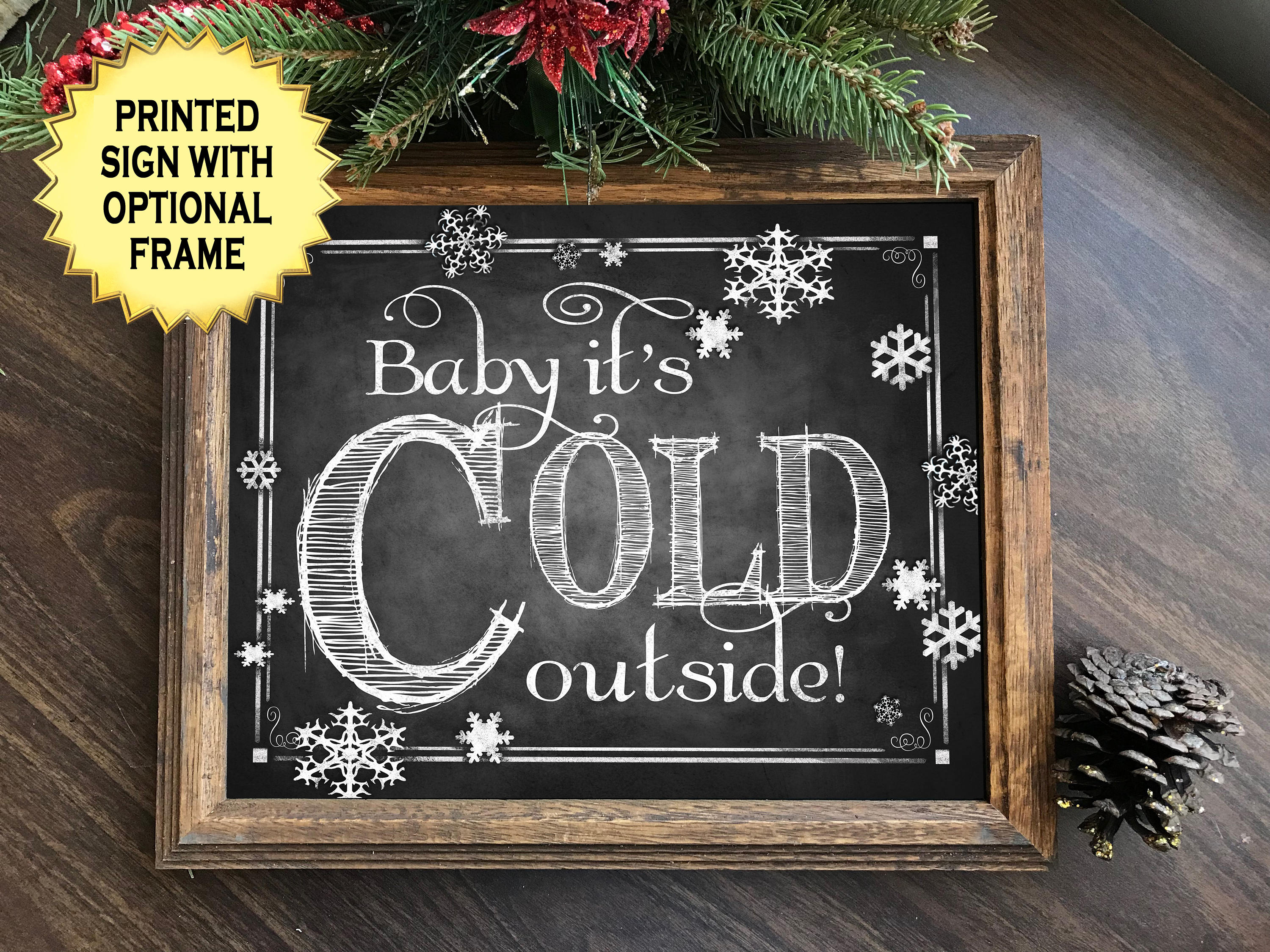 This charming Baby it's cold outside printed chalkboard sign looks lik...