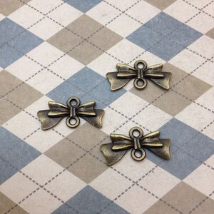 50 pcs of Bow Tie Connectors Antique Bronze Bowknot Charms 10mmx20mm