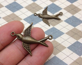 20 pcs of Antique Bronze Swallow Bird Dove Charms Two Loops 30mmx37mm