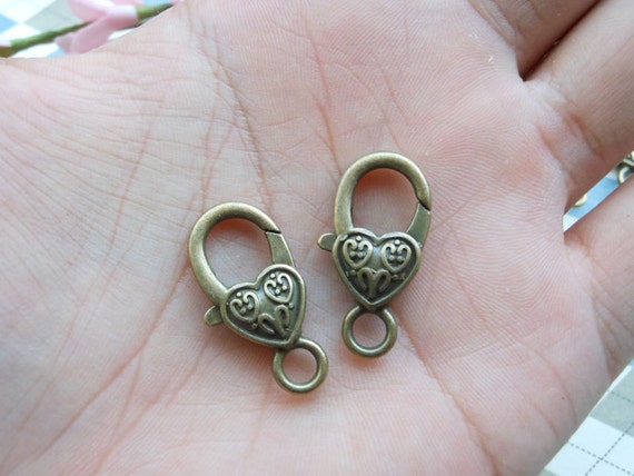 50 pcs / Bronze Color Lobster Clasp avec coeur coeur coeur (12 x 27 mm) coeur fermoir clasp.creative. Porte-clef clé Charms porte-clés porte-clés 945049 50 pcs / Bronze Color Lobster Clasp avec coeur coeur coeur (12 x 27 mm) coeur fermoir clasp.creative. Porte-clef clé Charms porte-clés porte-clés 945049