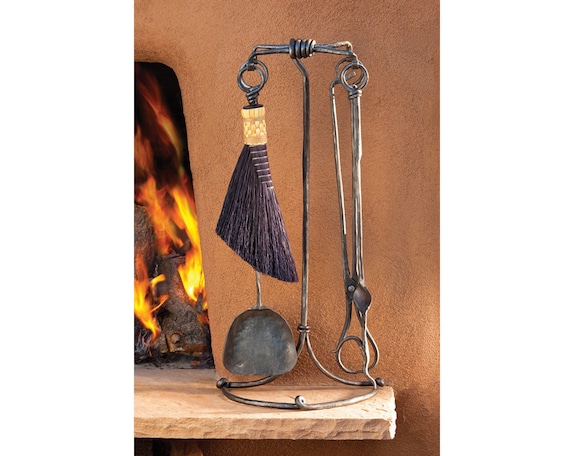 Christopher Thomson Ironworks is a named, established blacksmith studio — this $1,750 hand-forged fireplace set is heirloom furniture-grade craft, not a commodity.