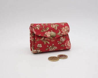 Monedero con 3 compartimentos en tejido General French rojo ladrillo, estampado floral en colores suaves