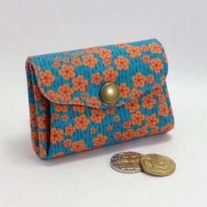 Accordeontasje, oranje oogjes op een turkooisblauwe achtergrond, 3 zakken, 2 flappen