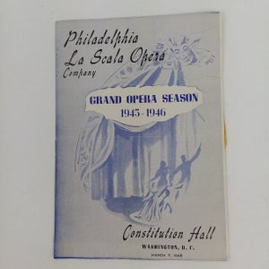 May include: A vintage program for the Philadelphia La Scala Opera Company's Grand Opera Season of 1945-1946. The cover is light blue with blue illustrations of curtains and figures. The program was for a performance at Constitution Hall in Washington, D.C.