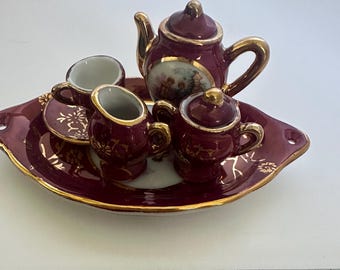Boxed Miniature Burgundy-and-Gold Porcelain Tea Set