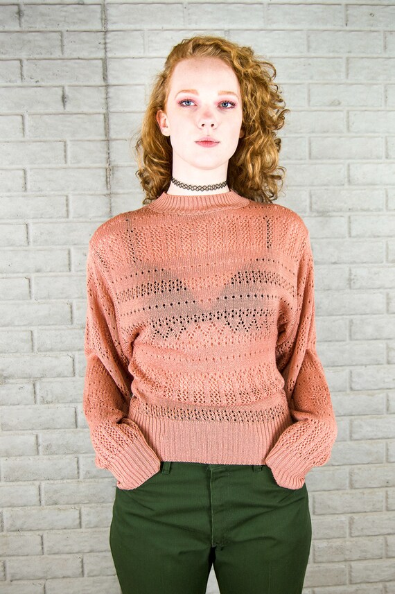 rose colored sweater