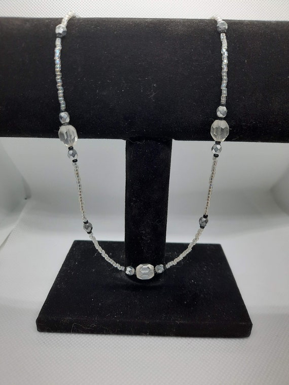 white with black necklace